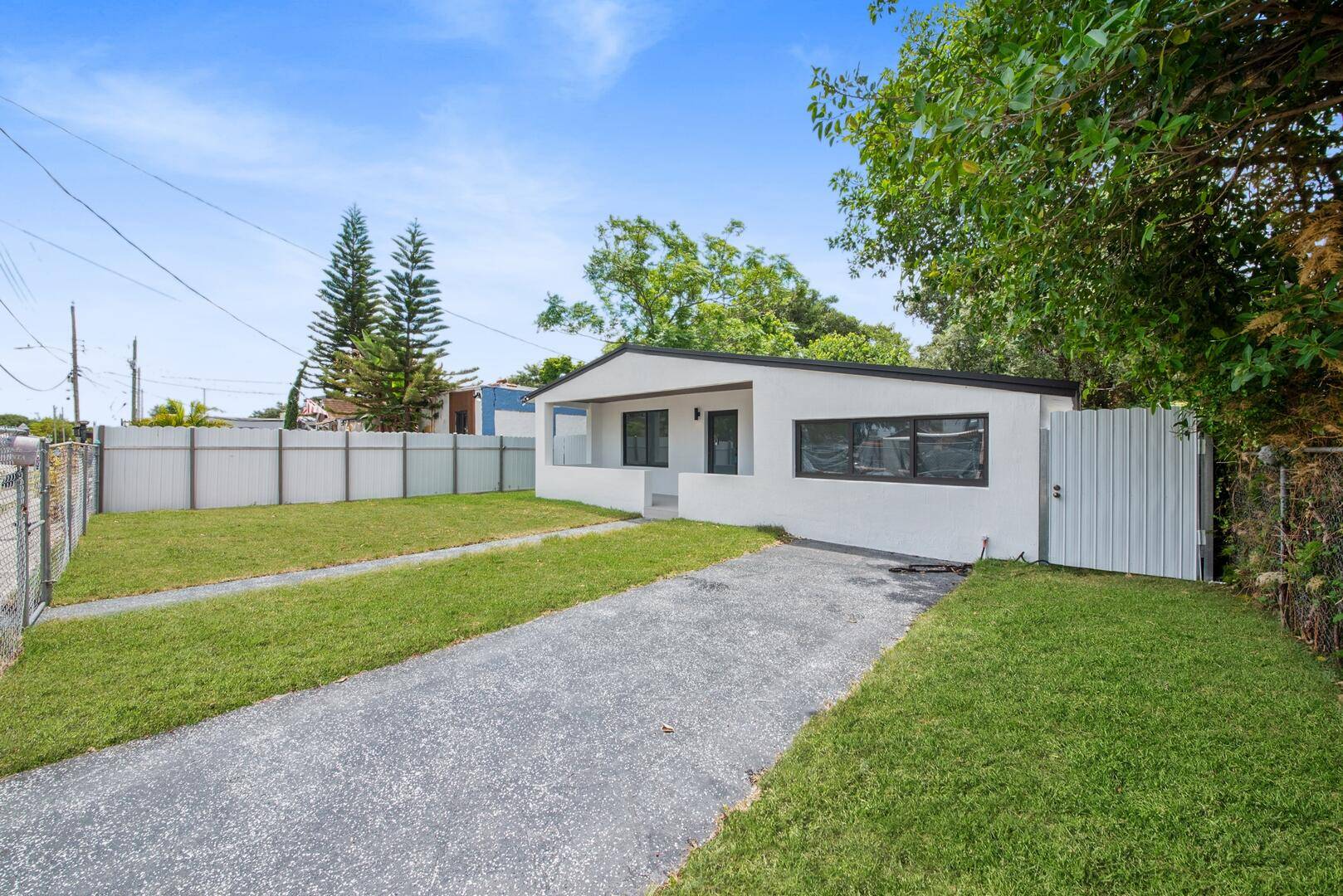 This fully updated home features an open floor plan with neutral flooring, high hat lighting, and newly painted walls that create a bright and welcoming atmosphere.