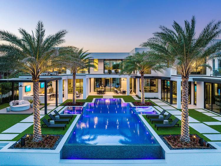 Introducing an exquisite Intracoastal Signature Estate by SRD Building Corp, nestled within Boca Raton's most prestigious community, the Royal Palm Yacht amp ; Country Club.