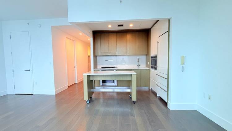 This spacious studio features a flexible living space and large bedroom with a huge closet, large windows, wide plank oak floors, and designer hardware and fixtures.