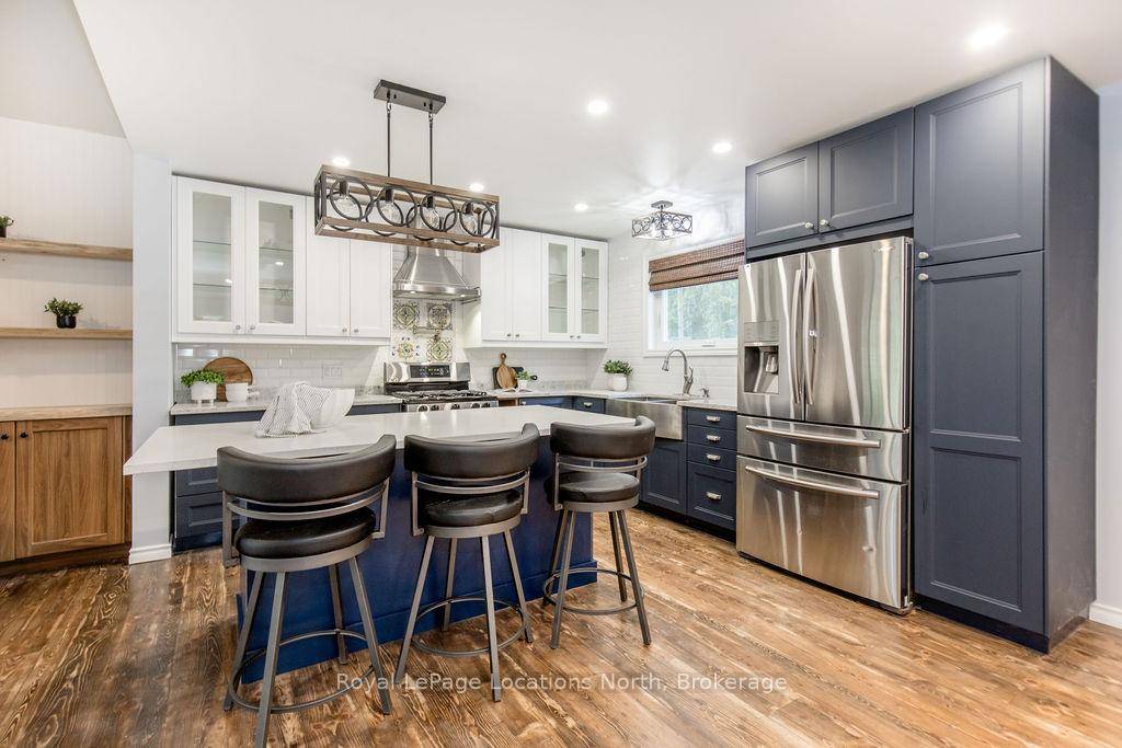 Discover your perfect getaway at this beautiful riverfront property with 100 feet of calm water frontage.