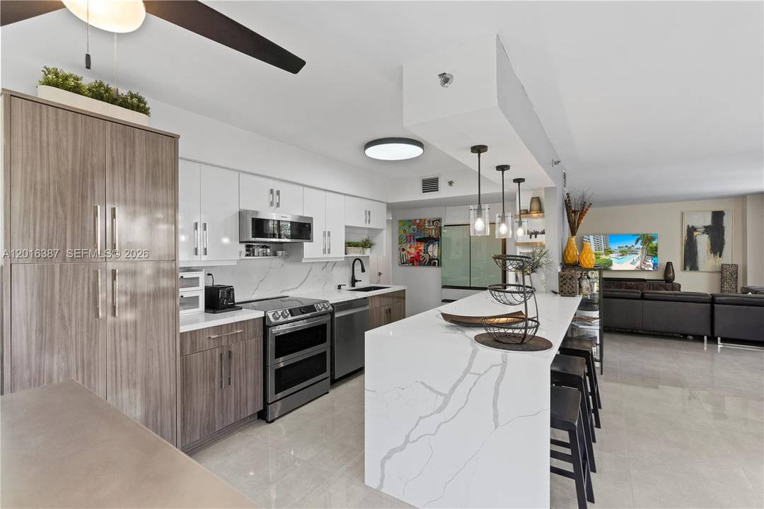 Wake up to tranquil Intracoastal views and sun filled living in this contemporary corner residence located within Mystic Pointe s resort style waterfront community.