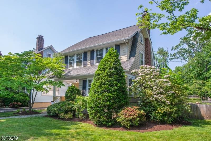 Charming side hall colonial in prime center of town location.