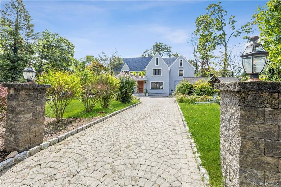 Spectacular, spacious, and sun filled Tudor style home featuring 4 bedrooms and 2.
