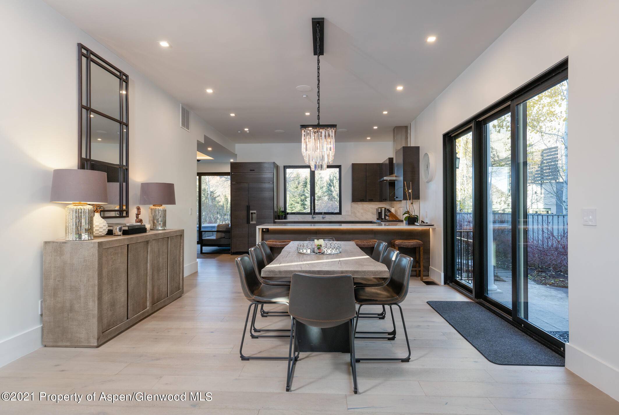 This stunning mountain contemporary Duplex, located by the Aspen Golf Course on a private cul de sac, is a must see.