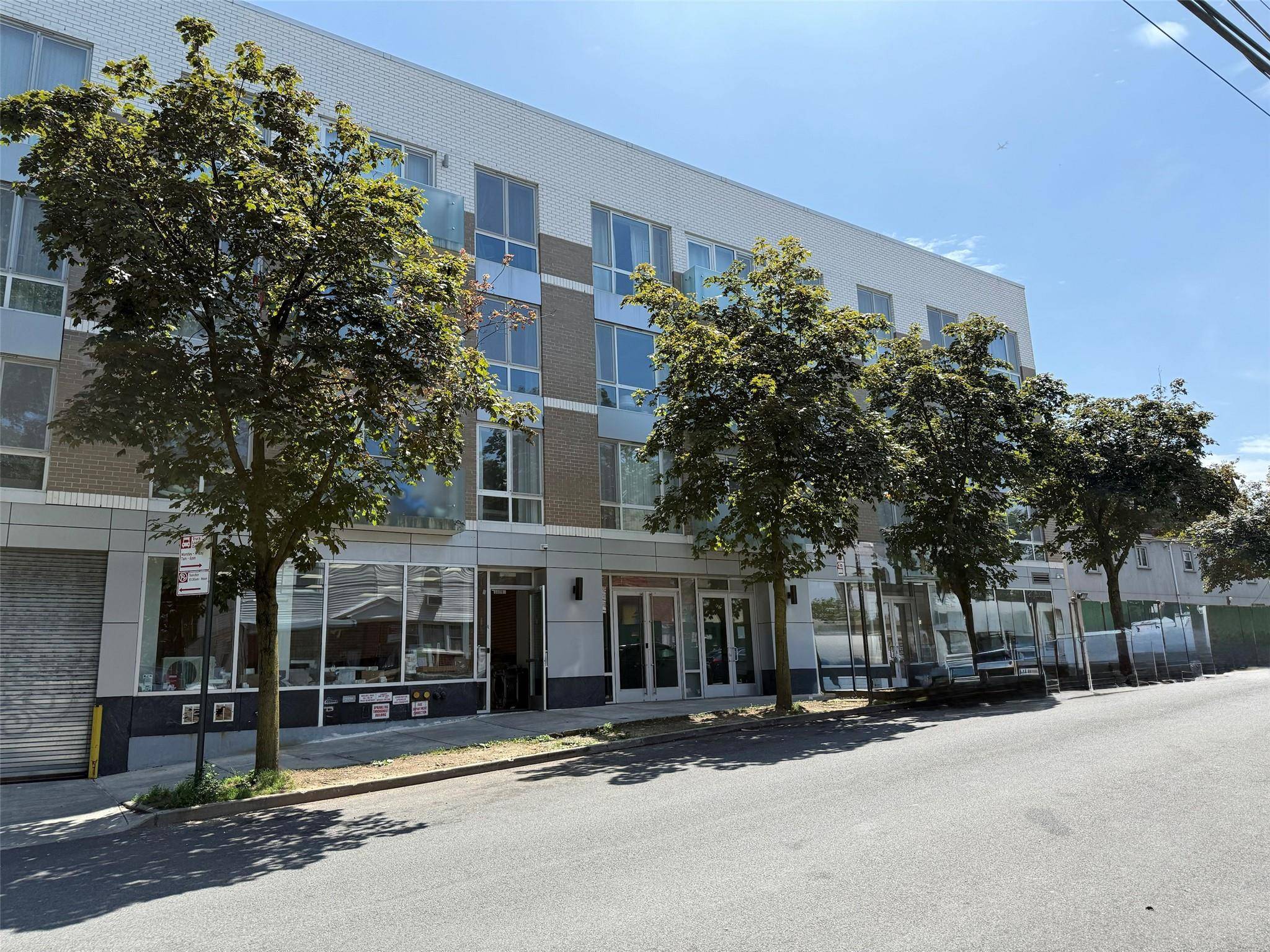 A one bedroom apartment with a modern design including a kitchen with stainless appliances, ample living space.