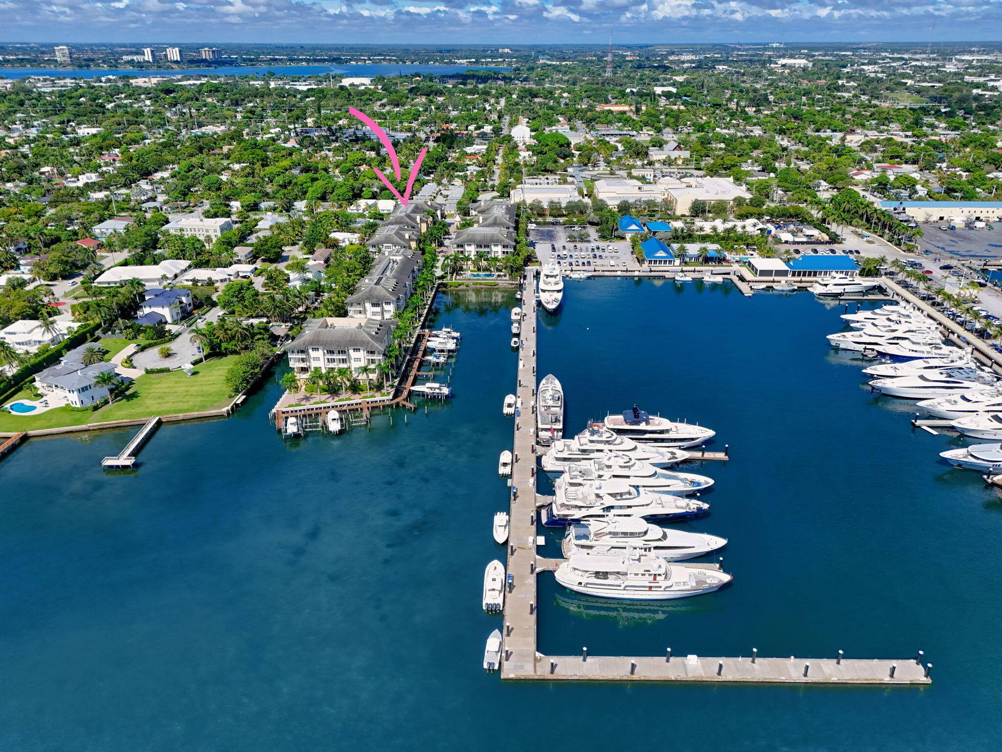 Luxury living awaits in this boutique waterfront community, ideally positioned beside the prestigious Rybovich Superyacht Marina and just steps from the Intracoastal.