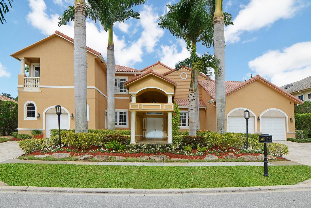 Magnificent Seven bedroom estate home overlooking the 11th fairway in Boca Grove.