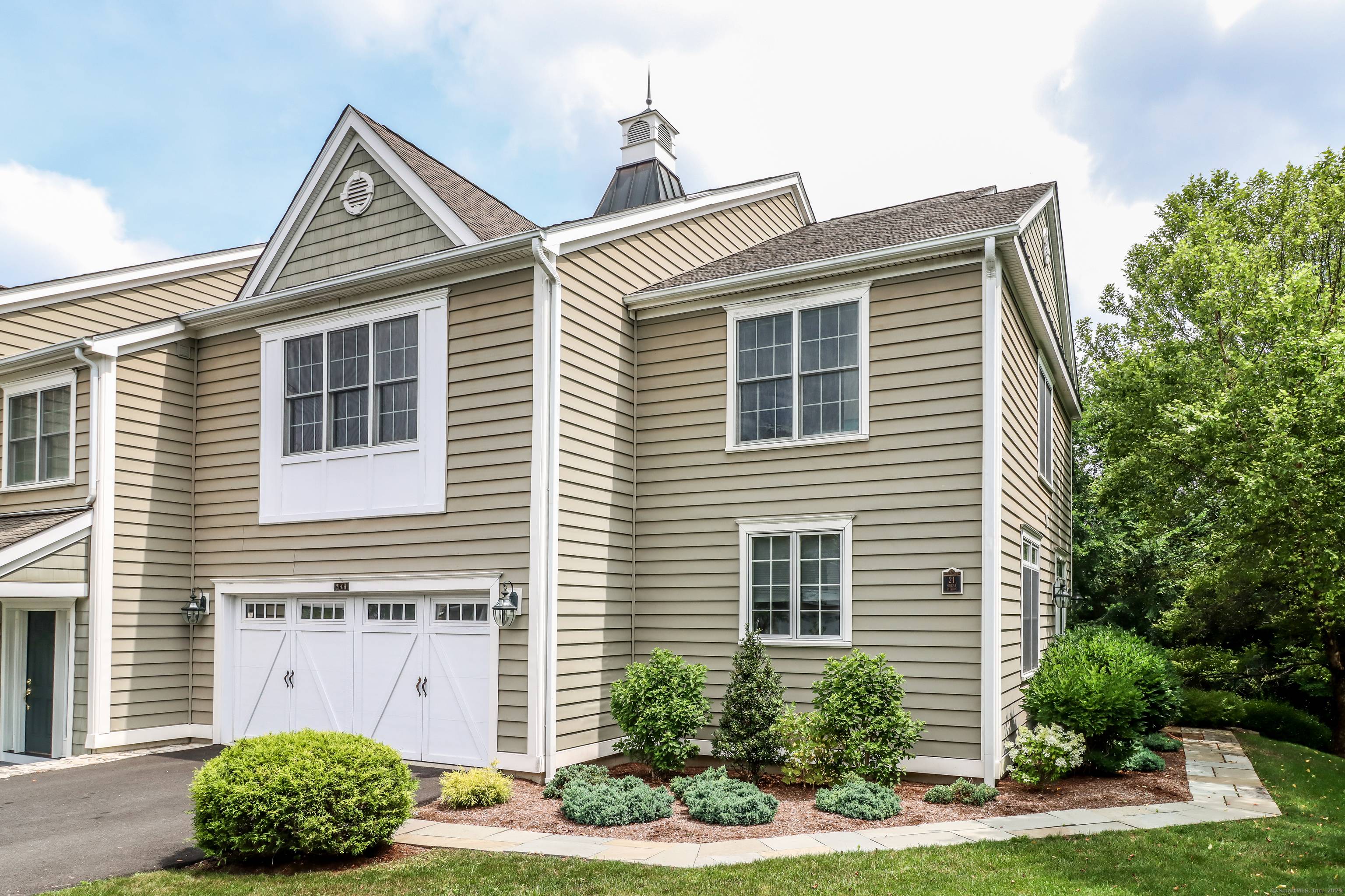 Experience refined living in this stunning townhome set in desirable Newbury Village.
