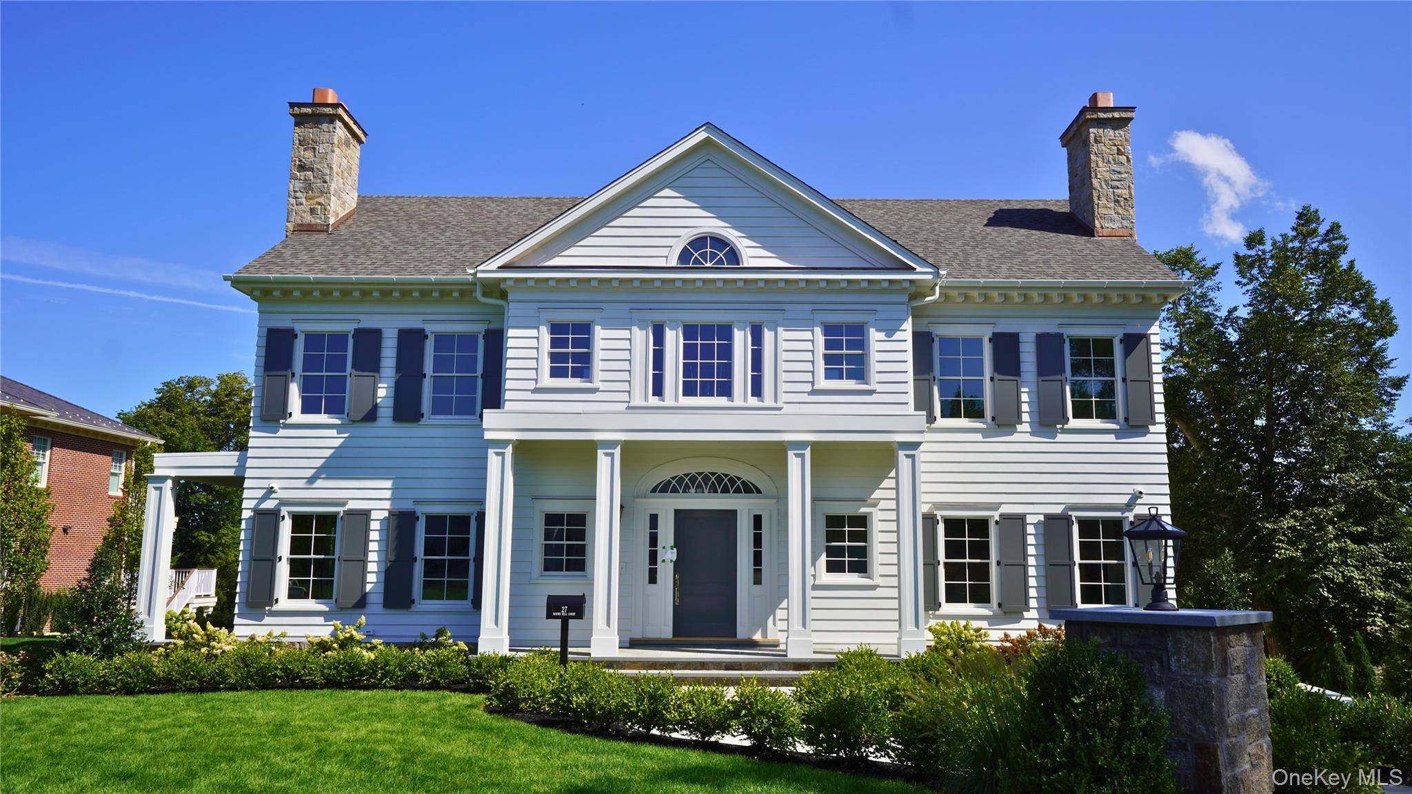 NEW CONSTRUCTION 27 Round Hill Ct Masterfully designed, this exquisite residence offers all of the finest amenities.