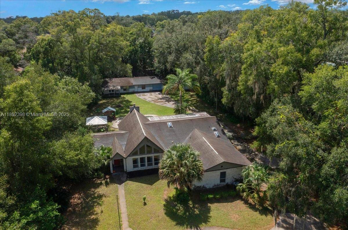 DiscovRare opportunity to own a unique 5 bed, 4 bath pool home offering peaceful privacy just minutes from town.