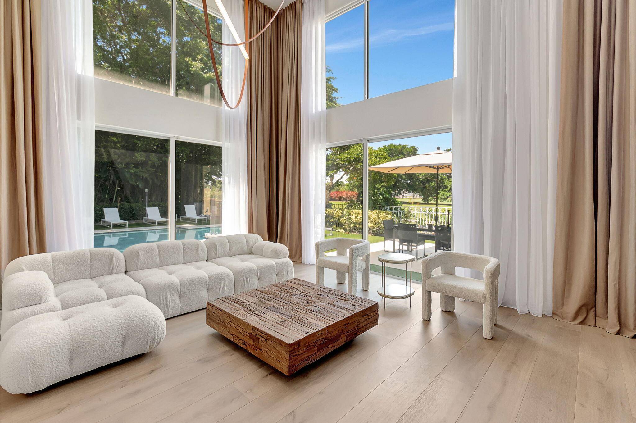 Welcome to this recently updated luxurious country club retreat nestled within the prestigious confines of Broken Sound.