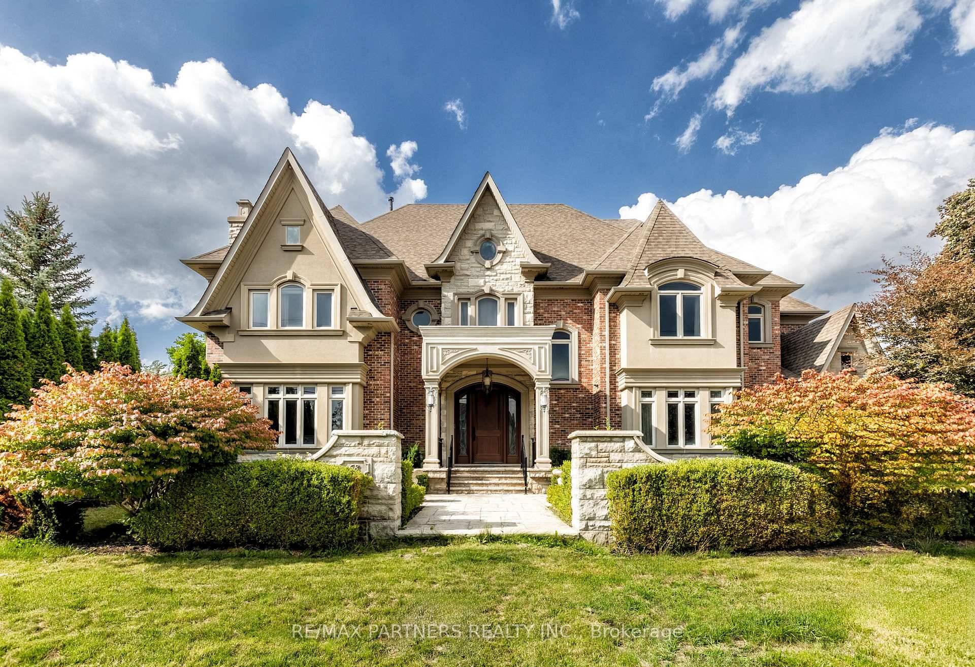 Experience Extraordinary Living In This Majestic Custom Built Estate, Surrounded By Lush, Mature Landscaping And Unparalleled Curb Appeal, This Residence Offers 7000 Sq.