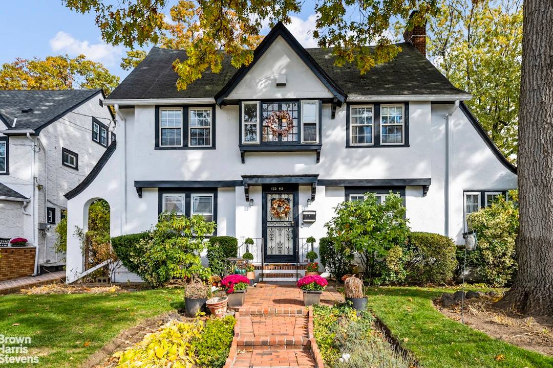 Landmarked Tudor style home for sale in Addisleigh Park, one of Queens' most historic and architecturally rich neighborhoods.