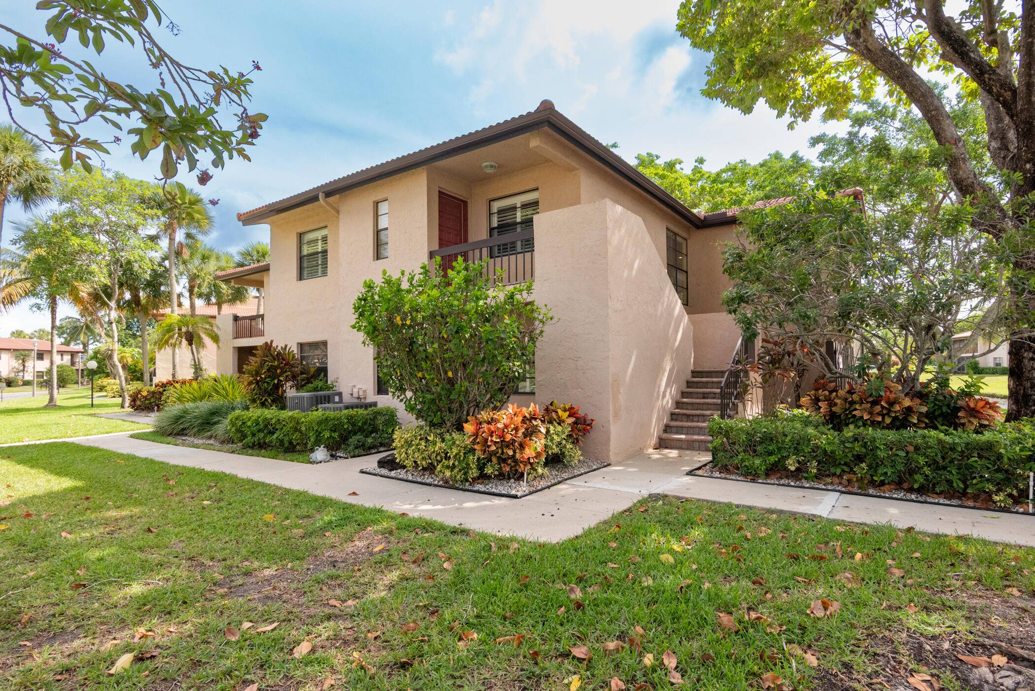 Gorgeous and fully updated WATERFRONT, lake view, corner unit in the highly desirable Boca Lago community.