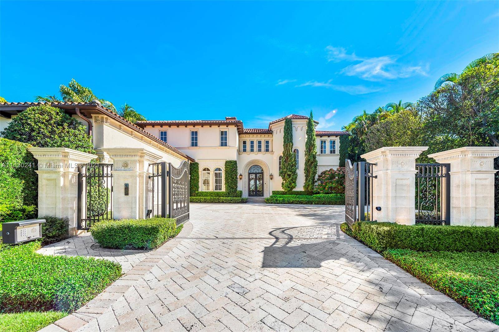 WELCOME HOME to modern elegance and waterfront serenity on esteemed Everglades Island, ideally located in the heart of Palm Beach.