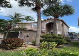 Welcome to your dream home in the prestigious gated community of Isola Bella, nestled in the heart of Palm Beach County.