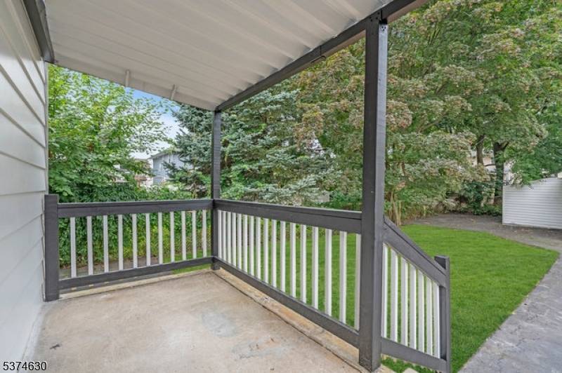 Newly renovated 4 bedroom, 2 1 2 bathroom center hall colonial on a tree lined street with an open floor plan.