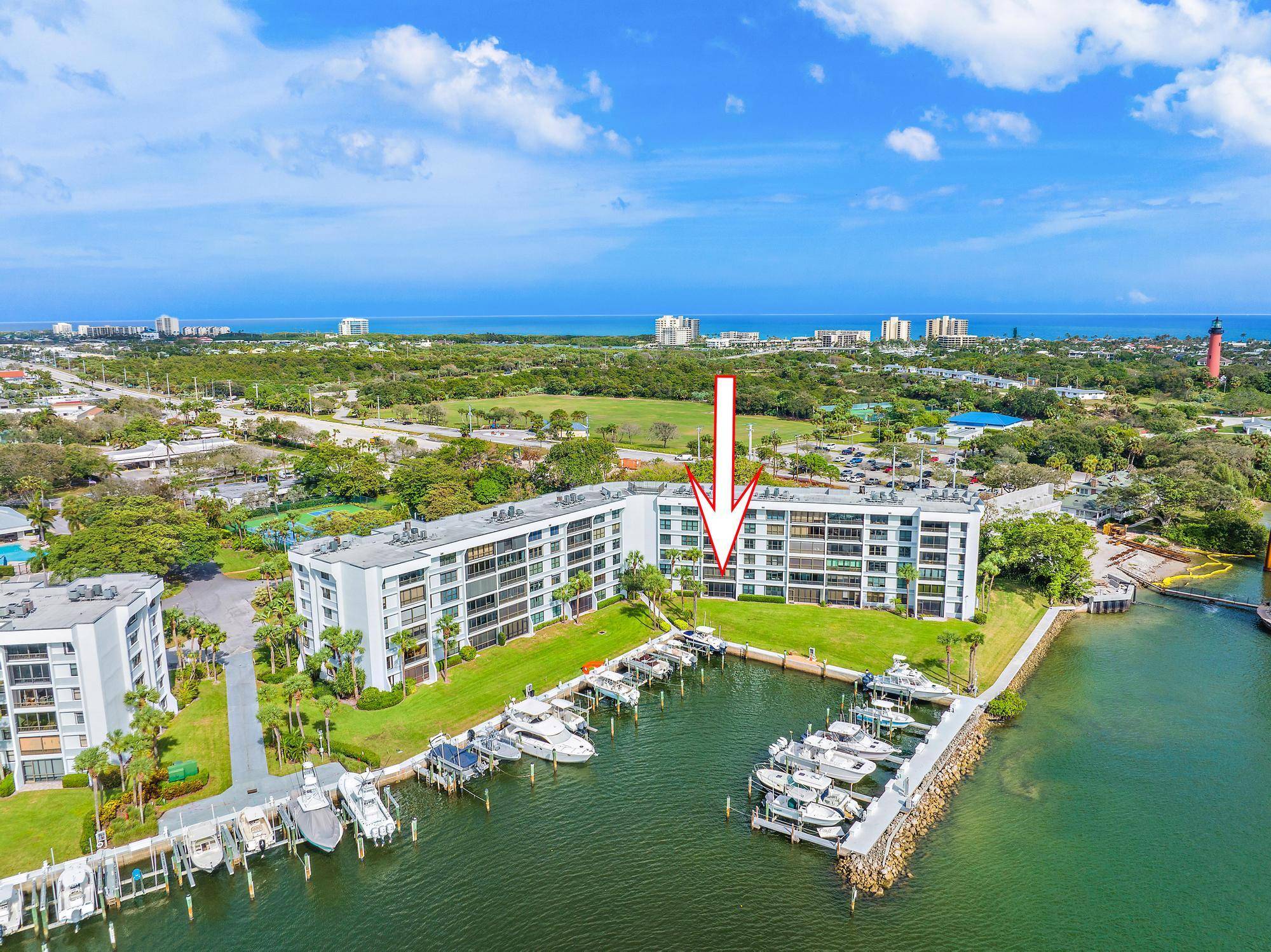Enjoy amazing views of Jupiter Inlet and the Intracoastal from this gorgeous waterfront condo in Jupiter Cove.