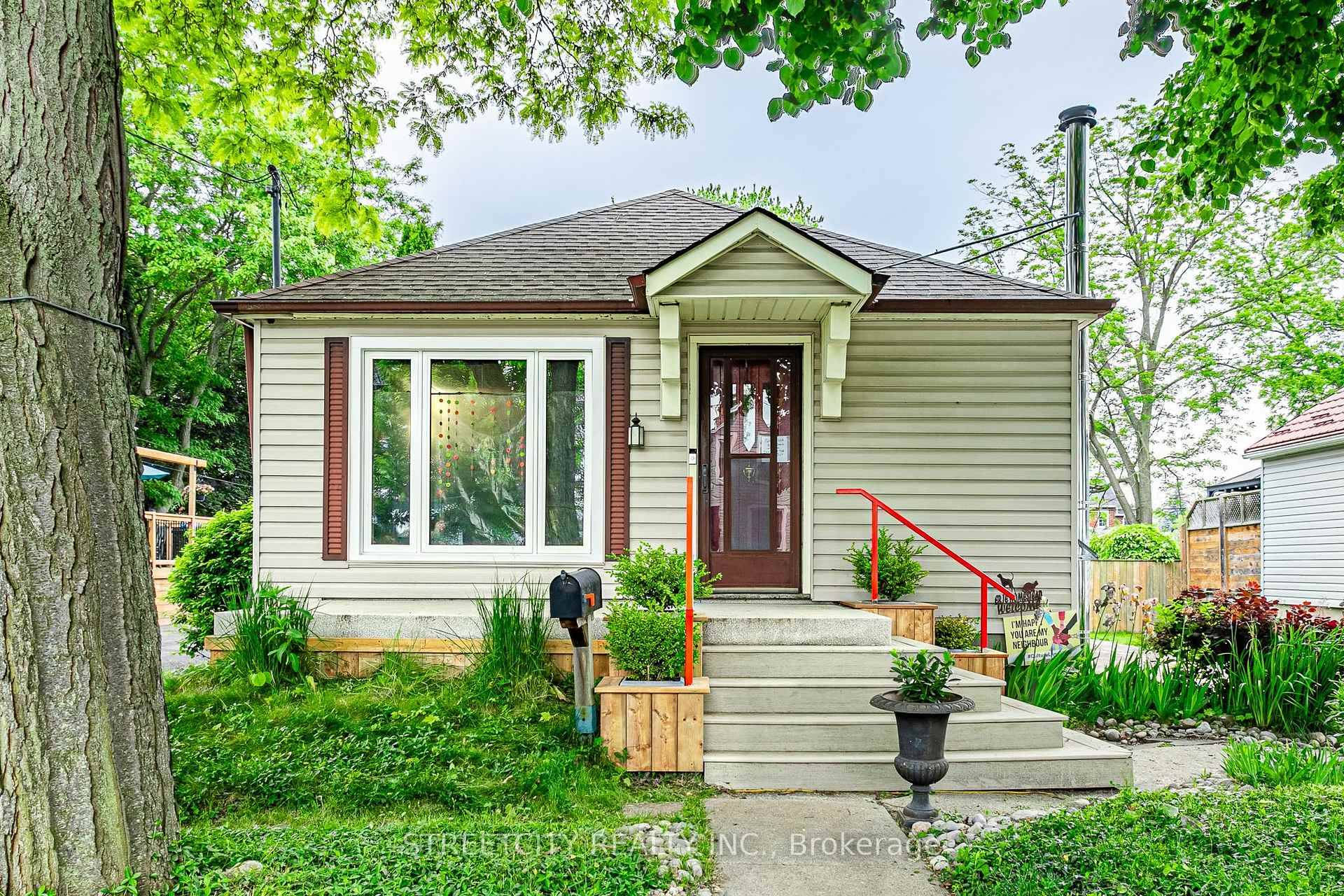 Charming 2 bedroom bungalow with spacious rear addition updated and move in ready !