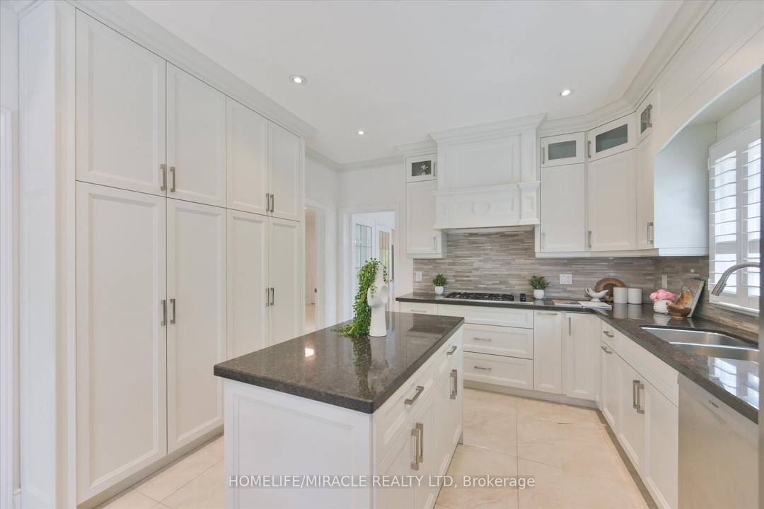 TUCKED AWAY ON A QUIET COURT IN THE PRESTIGIOUS SHERWOOD FOREST COMMUNITY, THIS ONE OF A.
