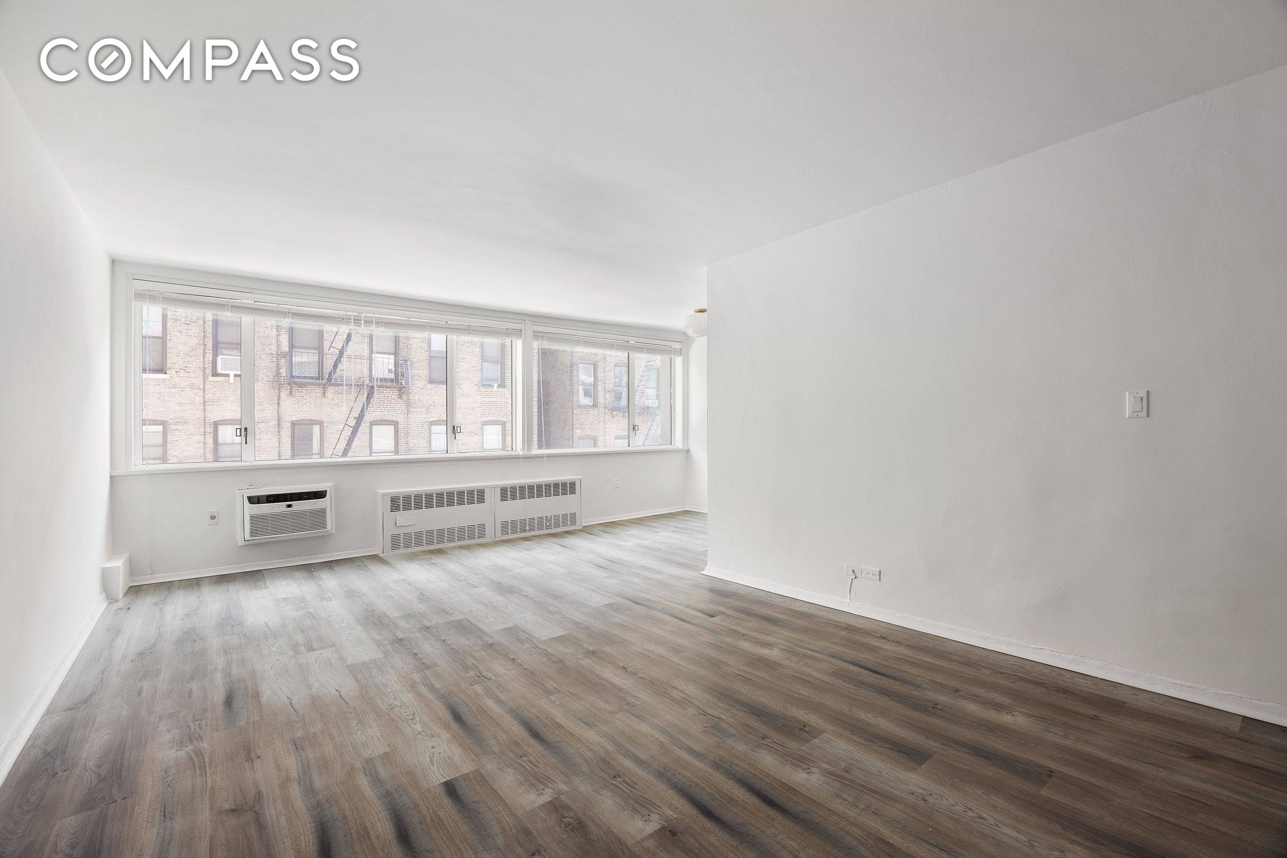 This thoughtfully designed alcove studio offers a highly functional layout, ideal for maximizing both style and space.