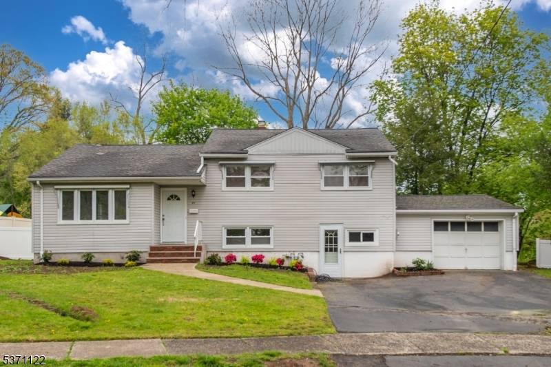 Welcome to this bright and updated split level home featuring 3 bedrooms and 1.