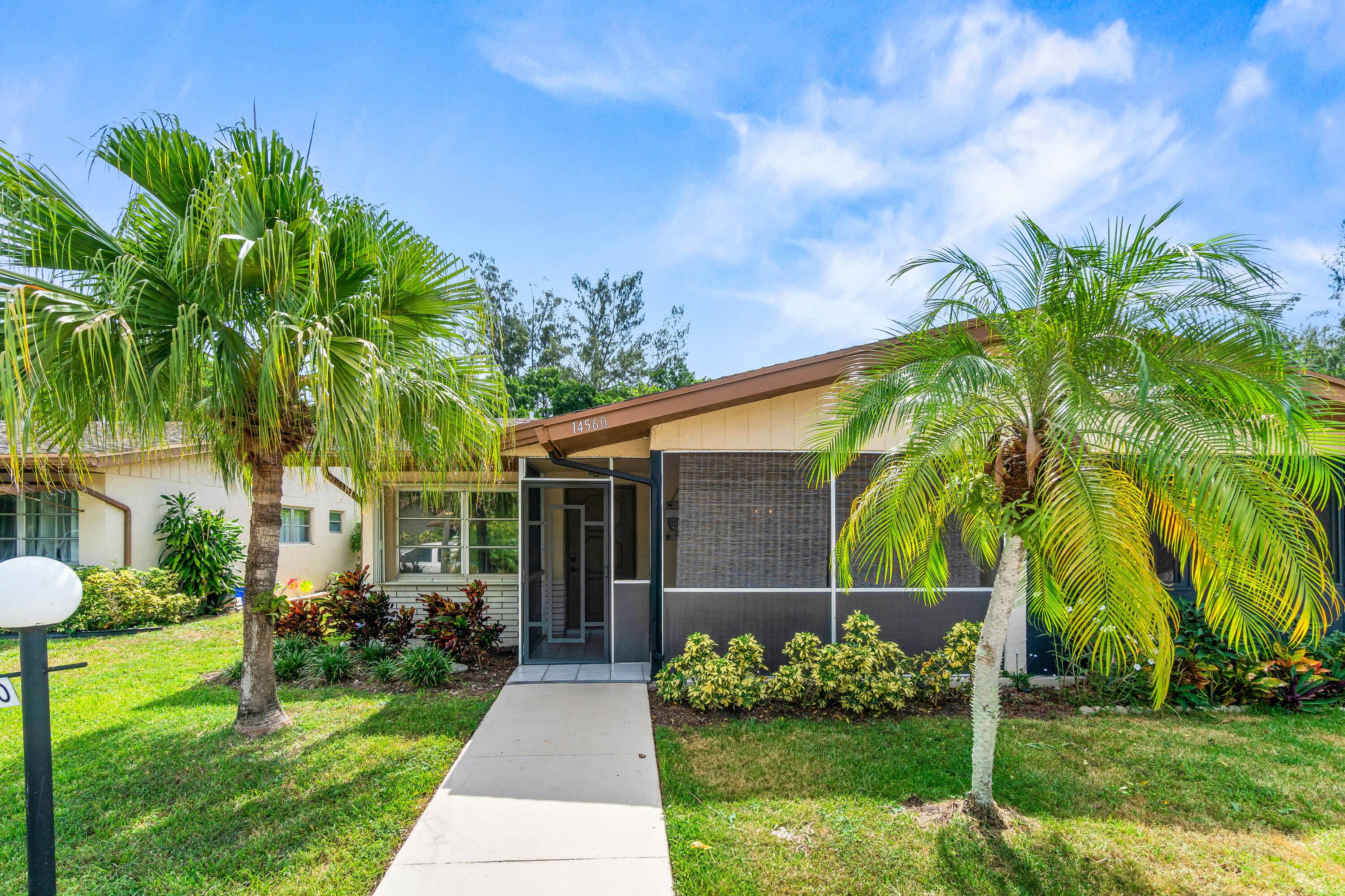 Welcome to this lovely villa in the 55 community of Delray Villas where natural light floods every room, creating a warm and inviting vibe.