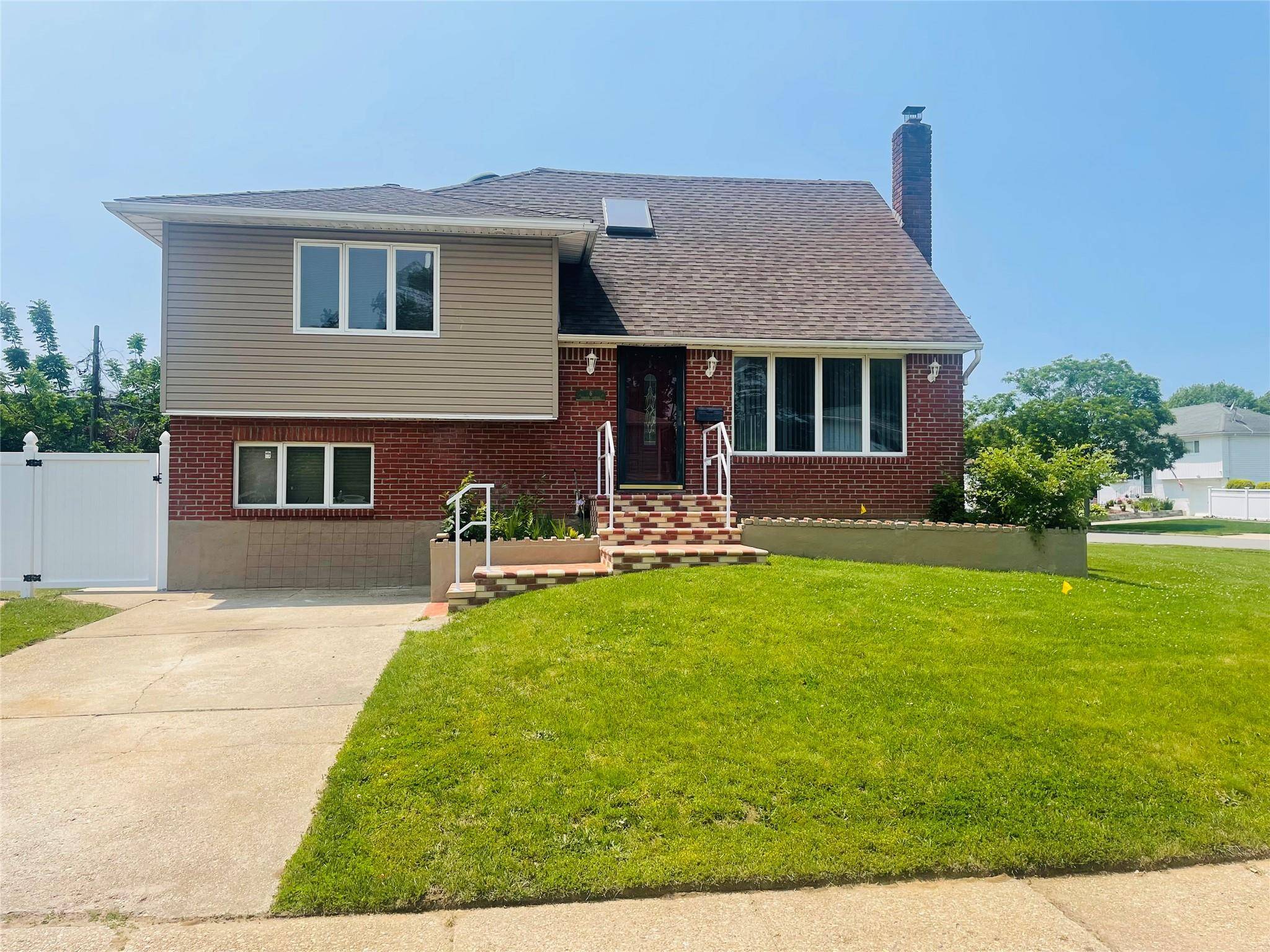 Welcome to this beautifully renovated split level home, featuring 4 bedrooms and 3 full bathrooms, ideally situated on one of the most prestigious blocks in Massapequa.