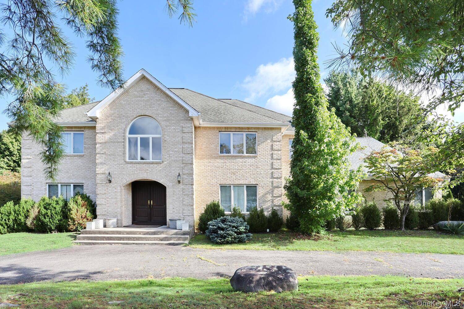 New City ! Custom built Center Hall Colonial set on a beautiful, flat property on a desirable street.