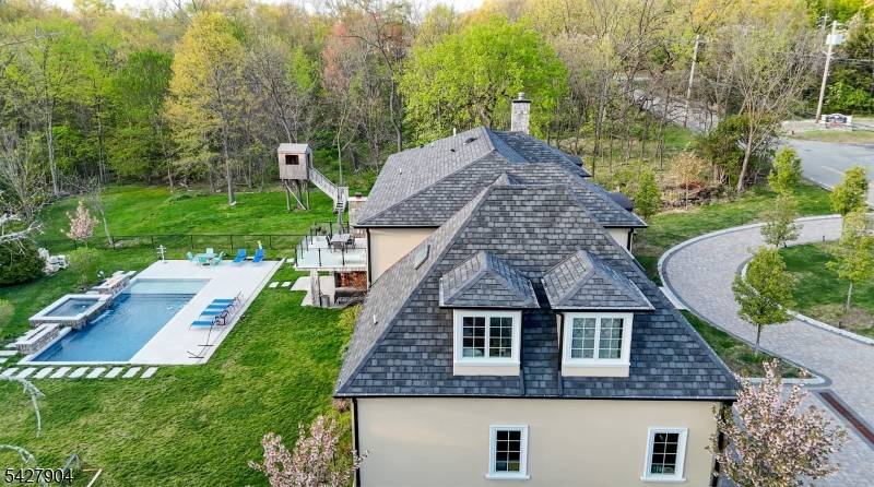 Located in the Riker Hill section of Livingston, this custom built residence offers a well designed layout with a range of interior and exterior amenities.