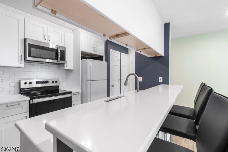 BACK ON THE MARKET Flooded with natural light, this bright and airy end unit condo blends style, space, and comfort fully updated in 2024 with no detail overlooked.
