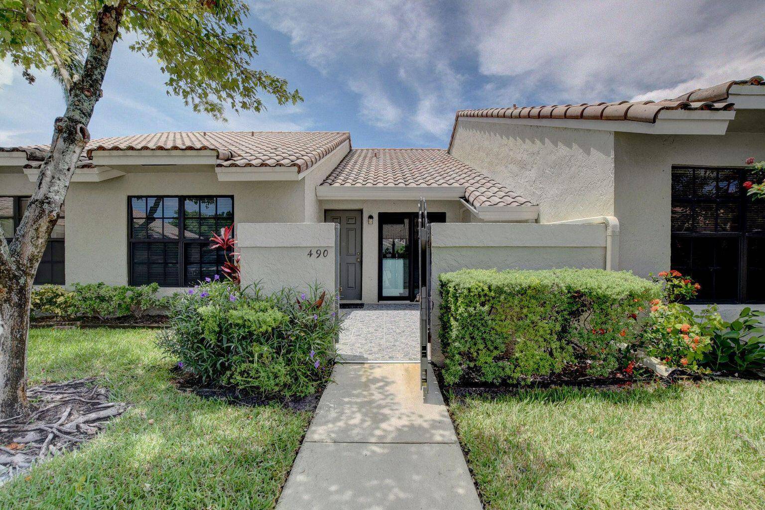 ABSOLUTELY GORGEOUS... FULLY RENOVATED TOWNHOUSE located in one of Boca's best kept communities of Windwood.