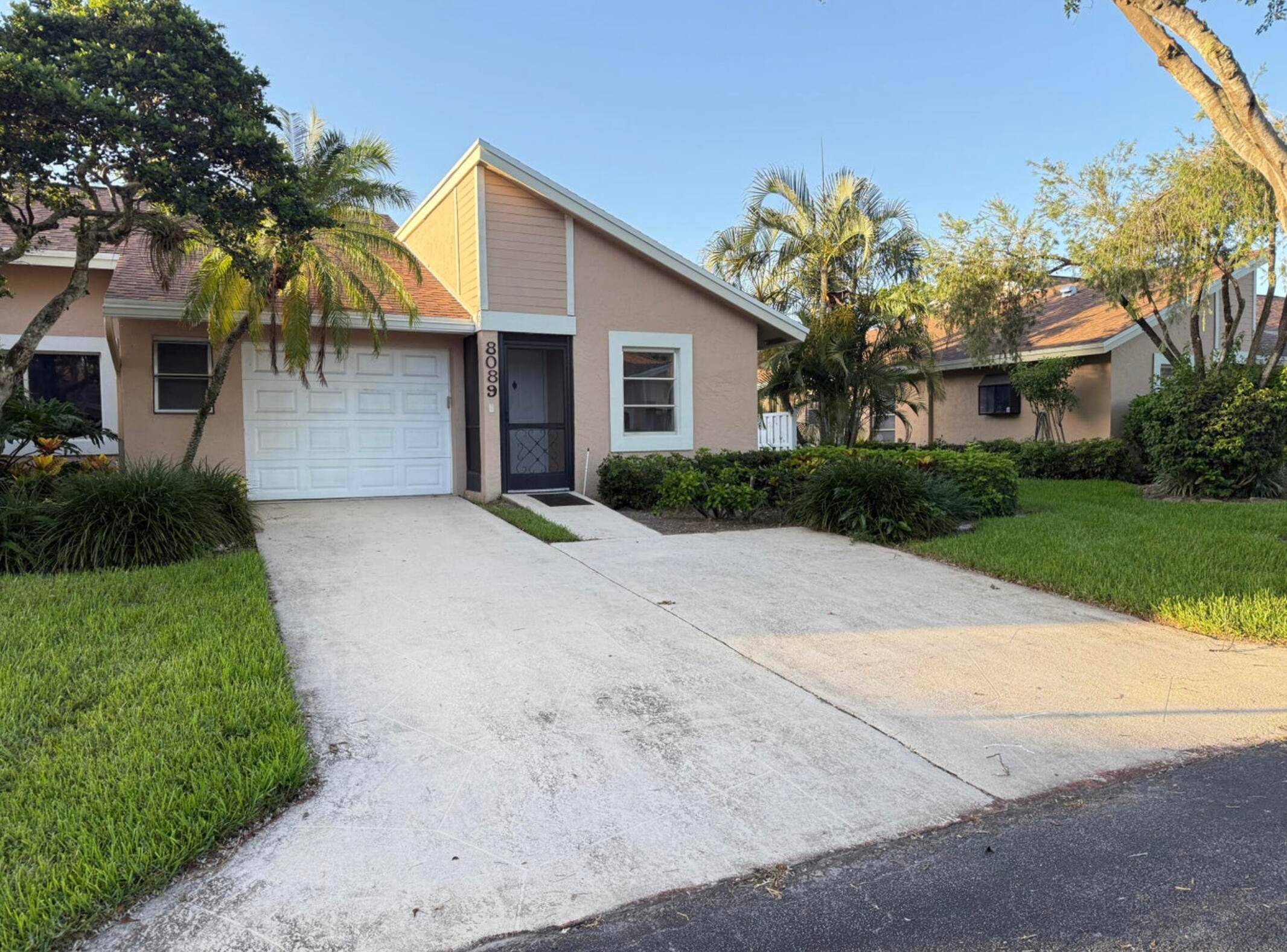 Welcome to this beautifully updated villa with a brand new roof, tucked away in the peaceful, gated community of Whisper Walk in Boca Raton.