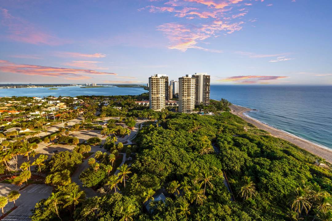 Elevated on the 19th floor of the prestigious Resort at Singer Island, this exquisite 3 bedroom oceanfront residence captures intoxicating, park protected 180 degree views of the Atlantic and Intracoastal.