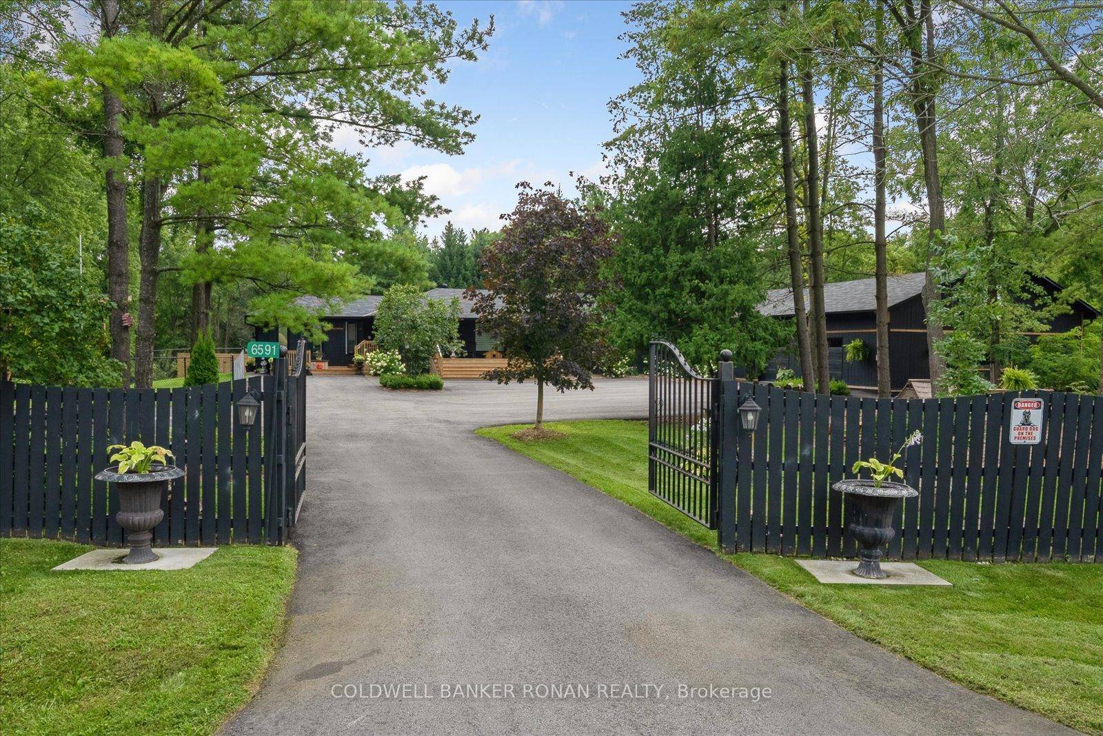 This custom built Bungaloft sits on a rare 650' wide lot that is lit up and manicured like no other 7 acres of usable land.