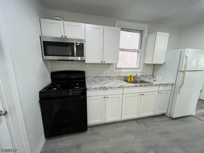 Investment Opportunity in Elizabeth, NJ 2 Family Property with Strong Rental Income !