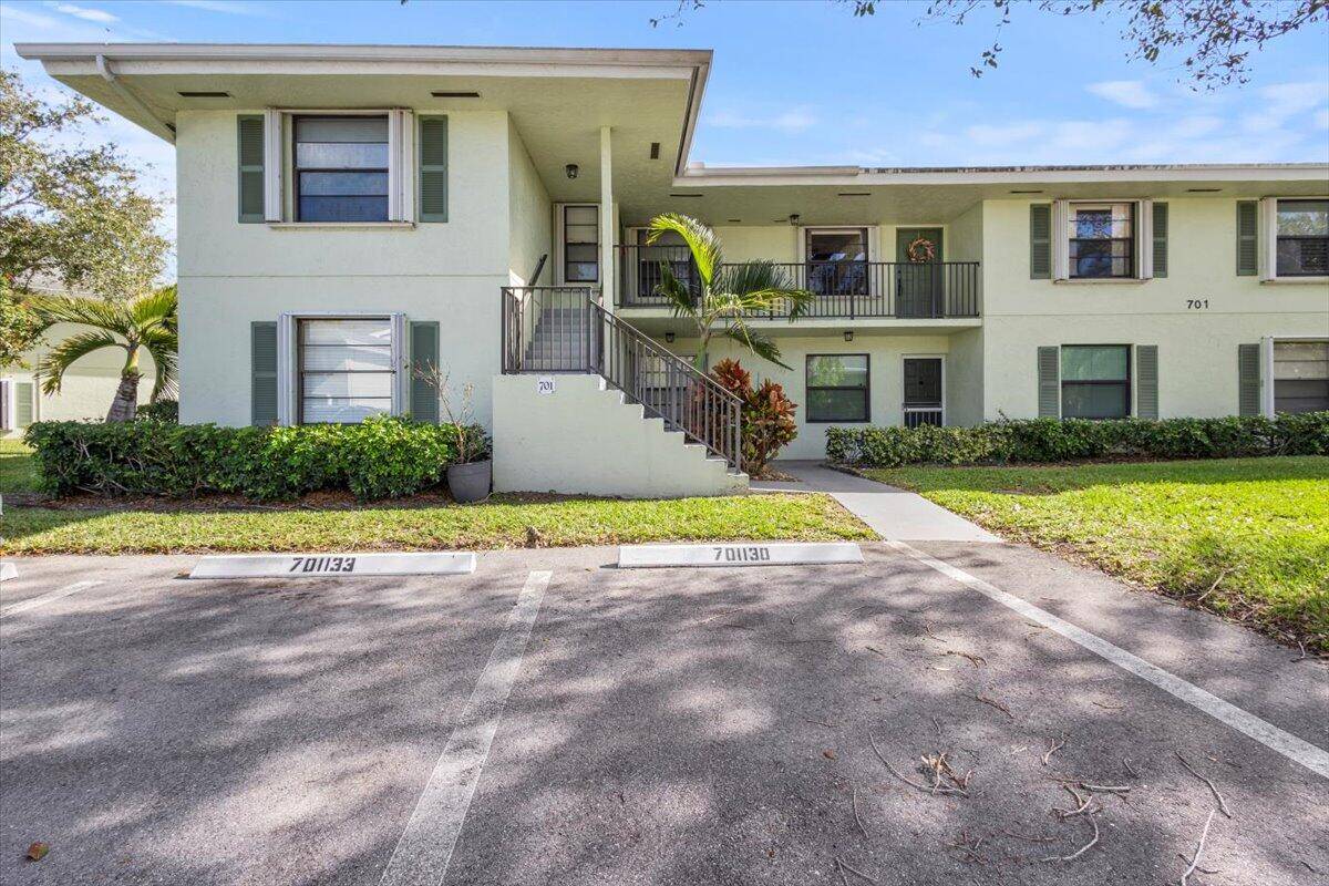 This is a stunning second story unit with a screen enclosed balcony facing the East overlooking a community lake and fountain.