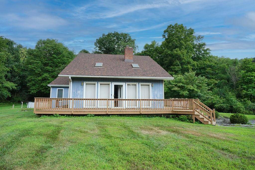 This contemporary home is located on a cul de sac street and sits on a 1.