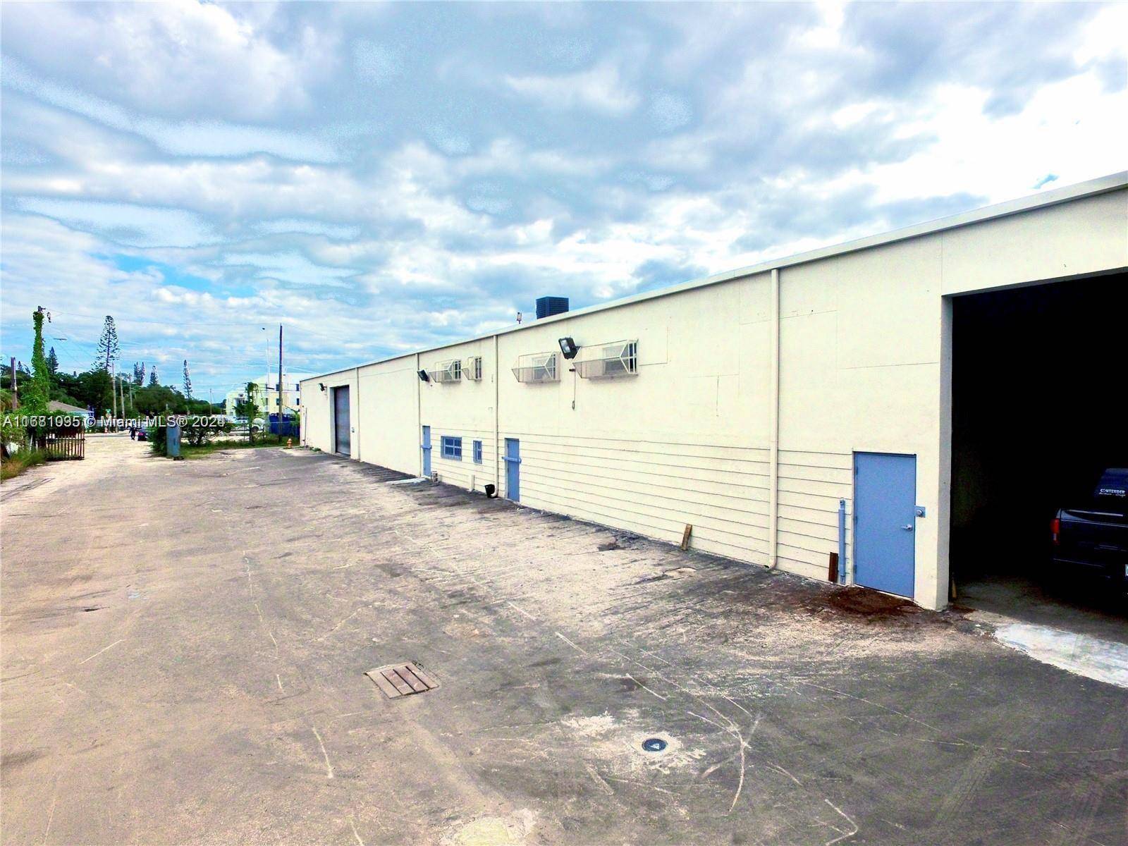 Centrally located and gated street level warehouse with NNN tenant leases for 20, 375.