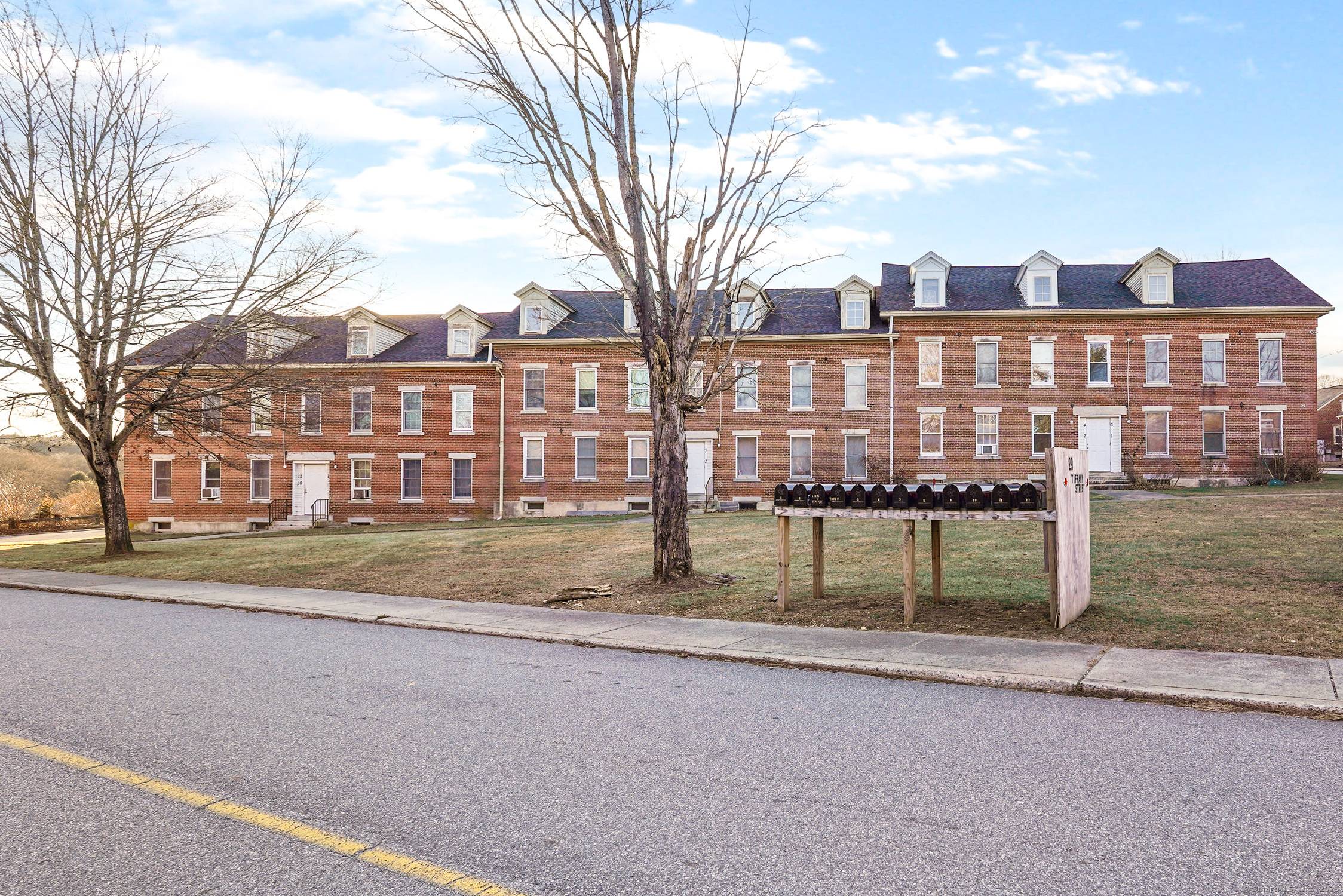 Attention Investors ! Rare opportunity to own a 12 unit brick multifamily building in desirable Brooklyn, Connecticut.