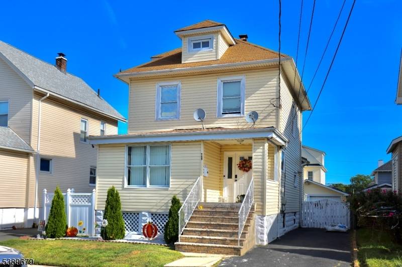 Welcome to this charming Colonial style home featuring four spacious bedrooms and two and a half beautifully appointed bathrooms.