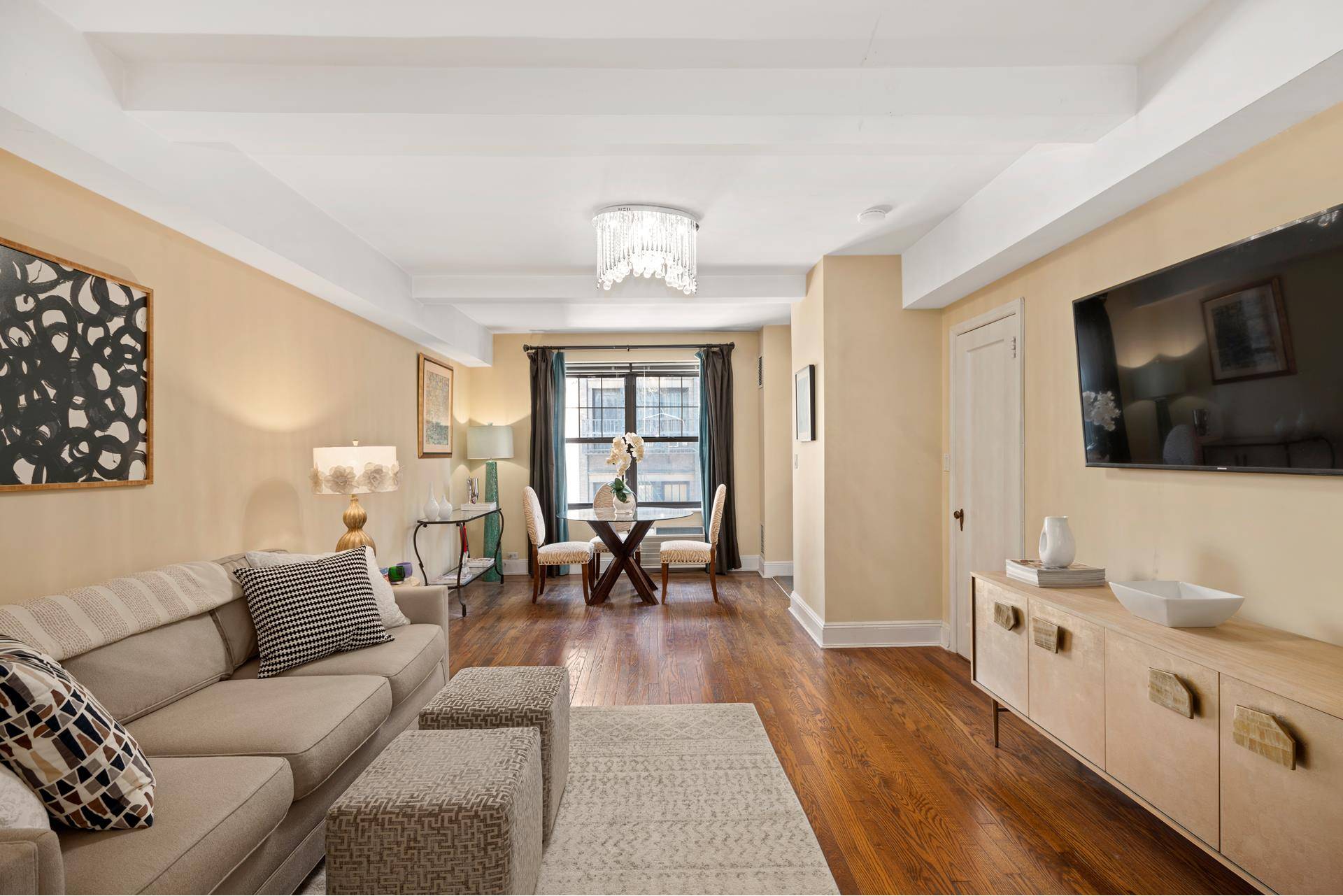 Must see this renovated prewar studio with many original details, including beautiful oak strip floors, beamed ceilings and original archway.