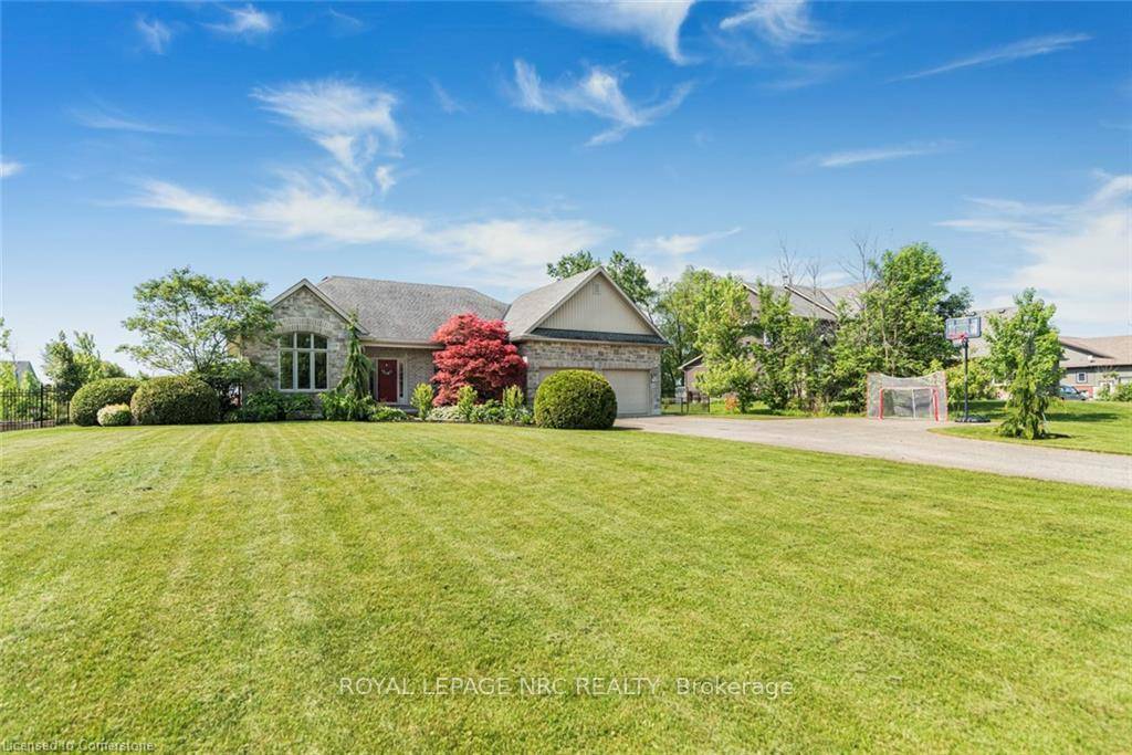 Nestled just a short stroll from the sandy shores of Lake Erie, this beautifully maintained 2 bedroom bungalow offers the perfect blend of comfort, style, and outdoor living.