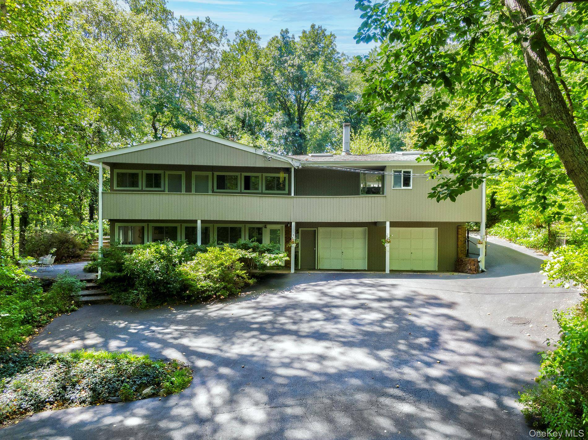 Welcome to this exceptional Expanded Ranch featuring 4 5 bedrooms and 4 bathrooms, nestled on 1.