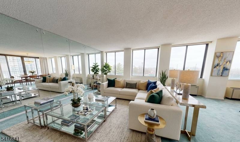 Welcome to this desirable corner unit residence at 300 Winston Dr 210 in Cliffside Park, offering stunning New York City views and abundant natural light.