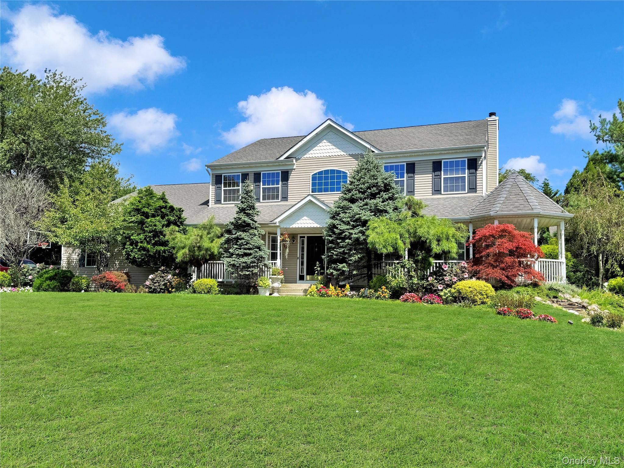 Spectacular Home In Manorville's Prestigious Pinewood Estates Which Offers Desirable East Moriches Schools !