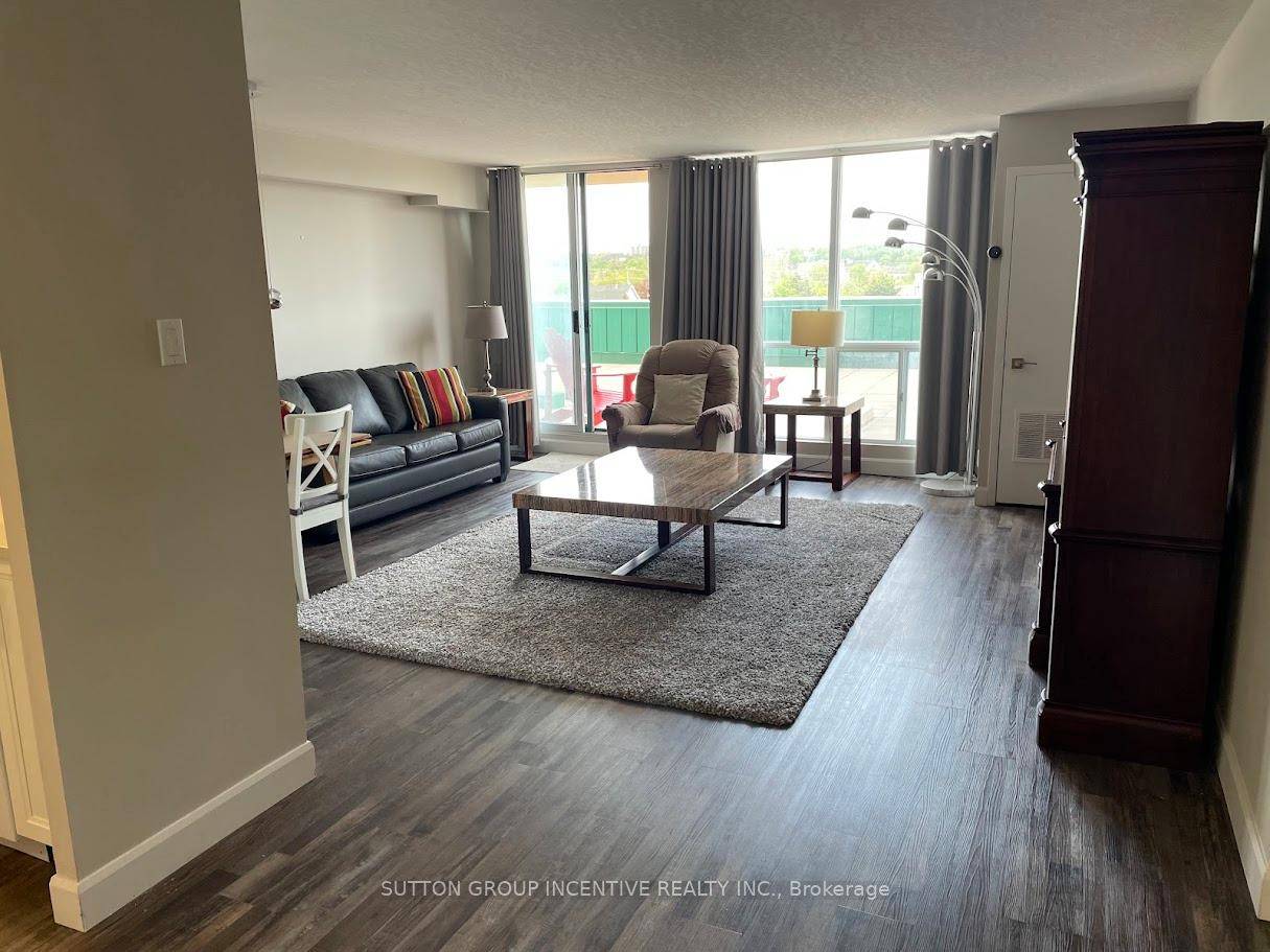 Step inside to discover a modern, carpet free interior featuring elegant laminate flooring, smooth ceilings, and oversized north facing windows that fill the space with natural light.