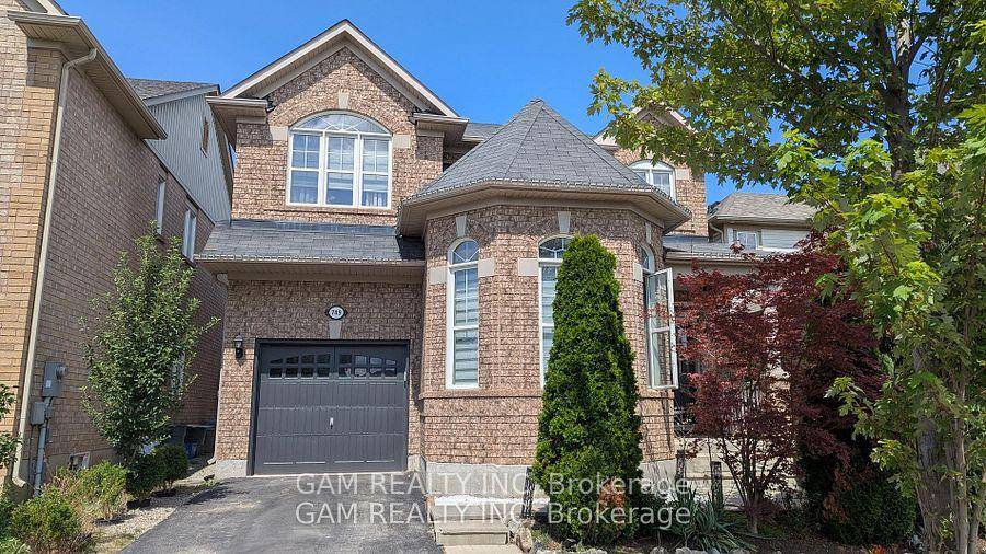 All brick, beautiful sun filled detached home located in a highly desirable neighbourhood.