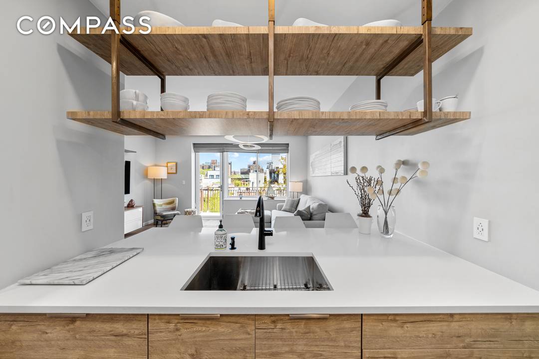 PENTHOUSE PERFECTION JUST IN TIME FOR SUMMER Step into this triple mint, fully renovated penthouse, where modern luxury meets effortless charm.