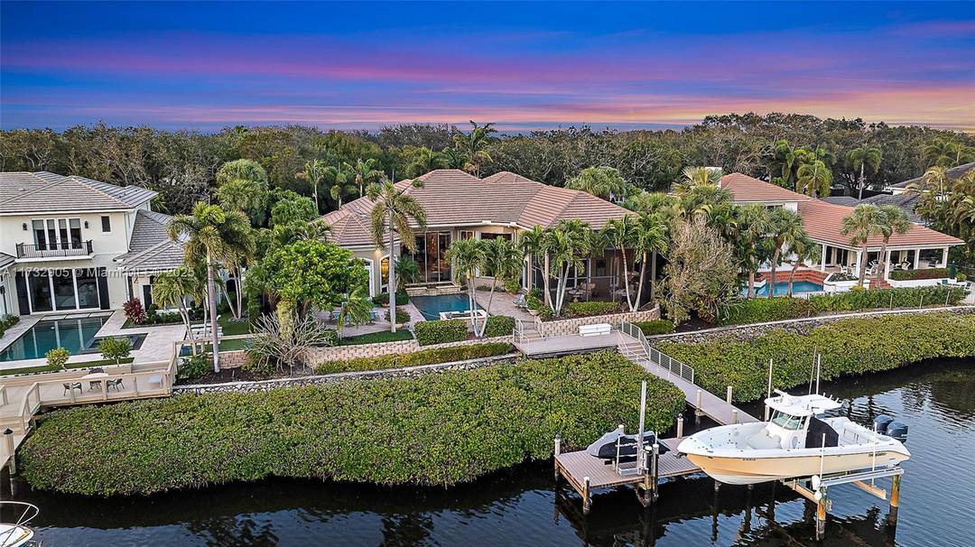 Discover the epitome of luxury living in this stunning 4 bedroom estate, perfectly situated in the prestigious Admirals Cove community.